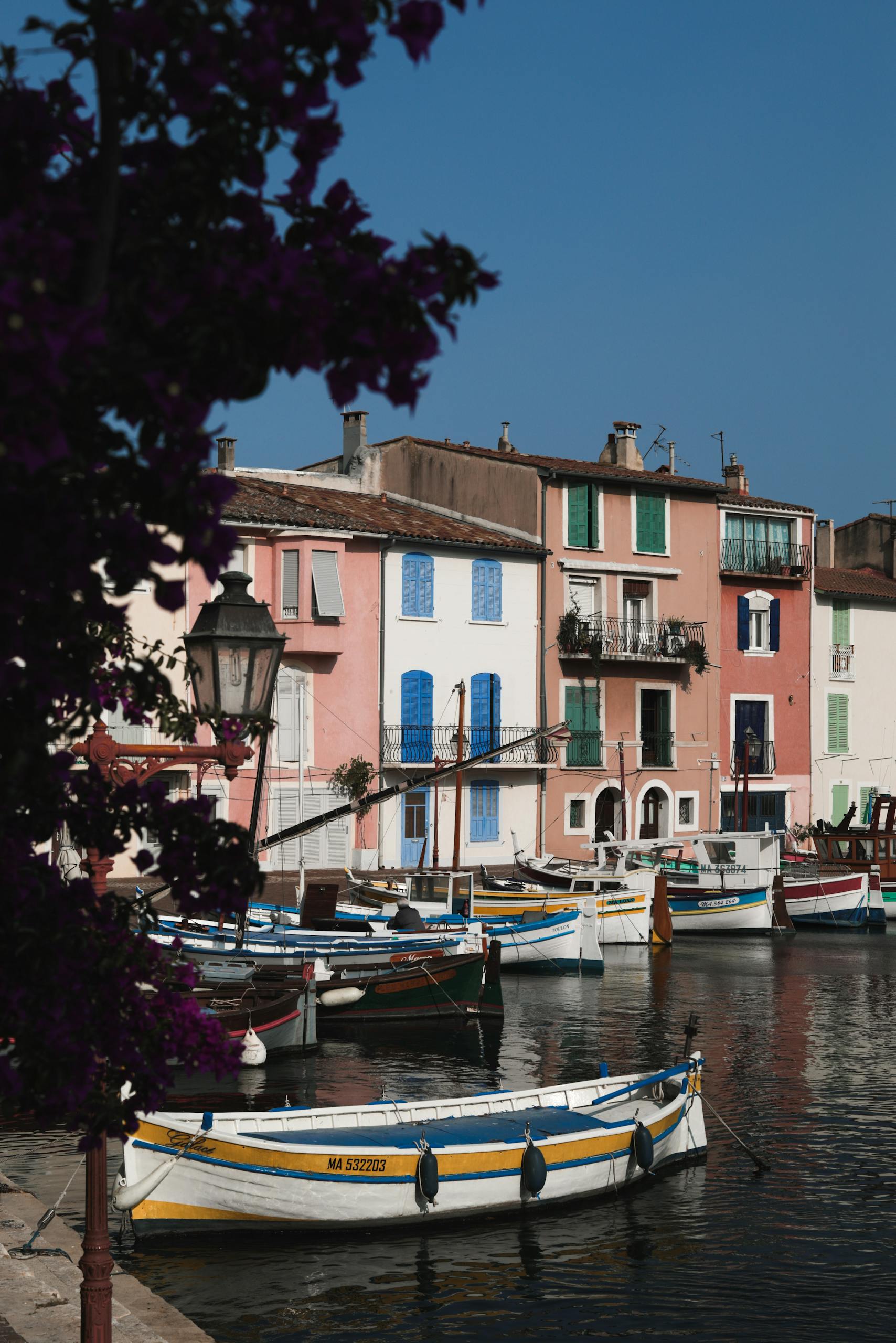 Colorful waterfront view in Martigues, Provence with boats and historic buildings.